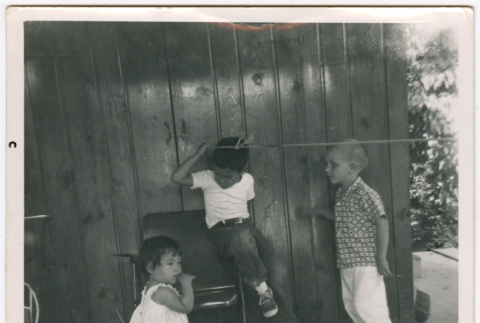 Three children on a patio (ddr-densho-433-595)