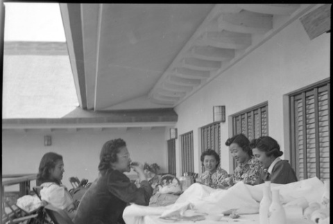 Overlapping exposures: group of women sitting at a table eating, Japanese Pavilion at Golden Gate International Exposition (ddr-densho-426-1638)
