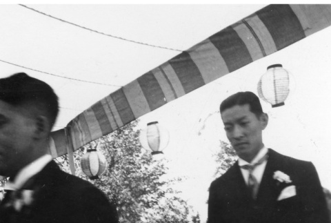 Two men walking in the procession at Tak Kubota and Kiyo Kaneko's wedding (ddr-densho-354-1547)