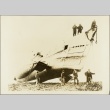 Men posing next to a beached submarine (ddr-njpa-13-570)