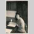 Woman seated at desk (ddr-densho-426-2428)