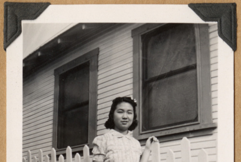 Girl beside a picket fence (ddr-densho-542-221)