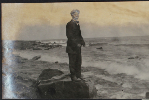 Man standing on shore (ddr-densho-355-620)