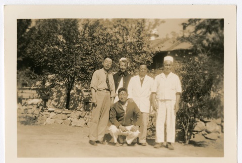 Henrietta Schoen posing with four Japanese men (ddr-densho-223-14)