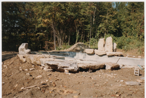 Pool with rock feature under construction (ddr-densho-377-2401)