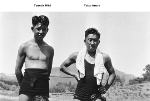 Four young men in swim trunks (ddr-ajah-6-762)