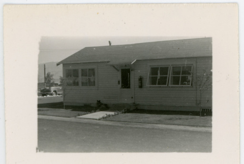Photograph of Manzanar staff housing with dog in front (ddr-csujad-47-350)