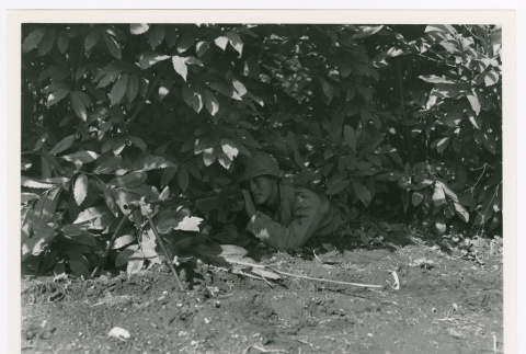 Soldier stationed in cover (ddr-densho-1007-167)