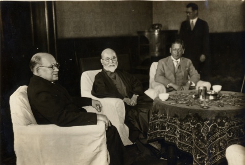 Konstantin Yurenev and two other men seated at a table (ddr-njpa-1-2641)