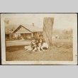 Nisei brother and sister with dog (ddr-densho-259-224)
