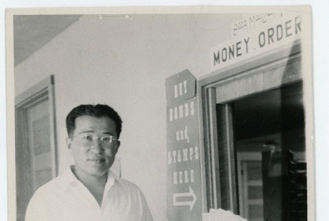 Man at money order counter (ddr-densho-37-2154)