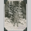 Man standing in snow outside building (ddr-ajah-2-390)