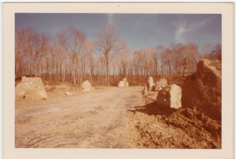 Rock pilars lining dirt road (ddr-densho-377-2174)