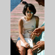 Marice Tatsuno sitting on the dock (ddr-densho-336-1074)