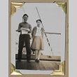 Man and woman lean against the rail of a ship (ddr-densho-404-234)