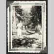 Mr. Shingue with a garden hose (ddr-densho-542-390)