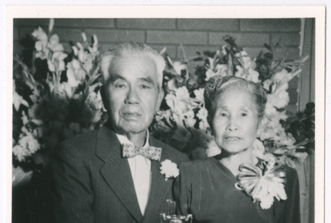 Kazuo Masuda's parents with tiered cake (ddr-densho-1007-13)