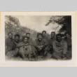 Nine soldiers sitting on hillside (ddr-densho-466-242)
