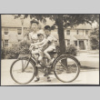 Woman with two children on a bicycle (ddr-densho-523-168)