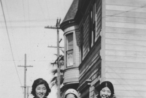 Three women standing on sidewalk (ddr-ajah-6-520)