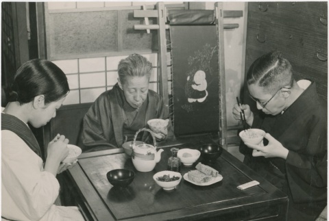 Japanese family sits down to a small dinner due to limited supply (ddr-densho-299-196)