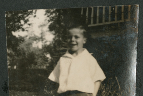 boy outside house (ddr-densho-378-704)
