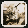 Walter Matsuoka and a companion pose with a car (ddr-densho-390-79)