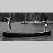 Campers standing on a canoe (ddr-densho-336-573)