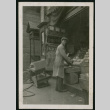 Man working at produce stand (ddr-densho-359-738)
