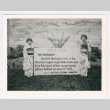 Two children with over-sized postcard from Lettuce Festival Committee (ddr-densho-1007-14)