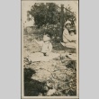A boy sitting on a blanket (ddr-densho-321-669)