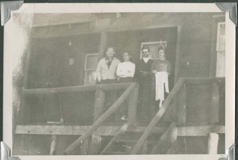 Group of four on porch (ddr-densho-321-442)
