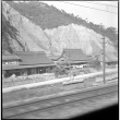 Photo of buildings, taken from train (ddr-densho-426-298)