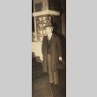 A man standing in a hat and jacket (ddr-njpa-4-164)
