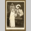 Japanese Peruvian female child in First Communion attire (ddr-csujad-33-128)