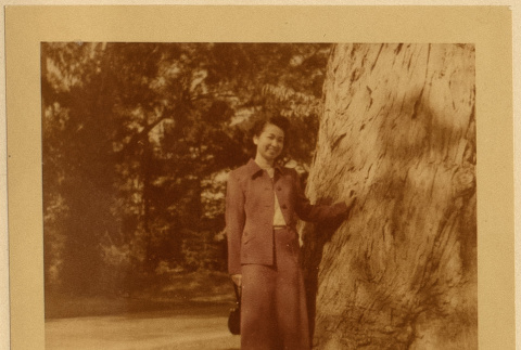 Ruth (Saitow) Kikawa by a tree (ddr-densho-542-32)