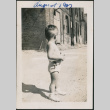 Toddler standing in dirt street looking back (ddr-densho-483-698)