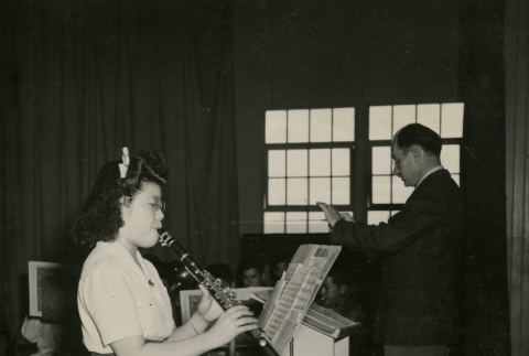 Japanese American playing the clarinet (ddr-densho-159-69)