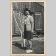 Signed photograph of woman in front of barracks (ddr-manz-10-80)