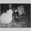 Child waiting with baggage (ddr-densho-37-436)