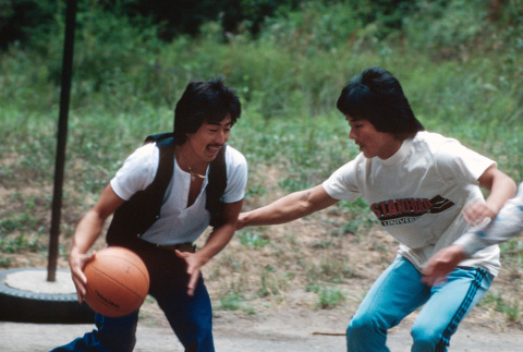 Gary Minamoto and Jeff Sasagawa playing basketball (ddr-densho-336-1284)