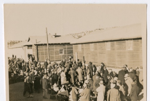 Crowd of people waiting with their luggage (ddr-densho-223-5)