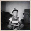 William Shiomi sitting on floor (ddr-densho-522-253)