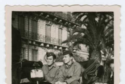 Soldiers sitting in carriage (ddr-densho-368-174)