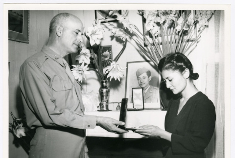 Shuzuko Kina receives her late brother's Silver Star (ddr-densho-1007-311)