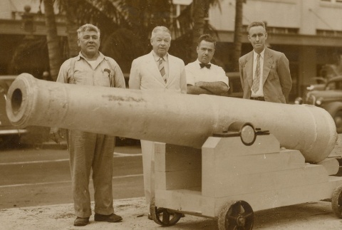 Charles Crane and other men posing with a cannon (ddr-njpa-2-198)