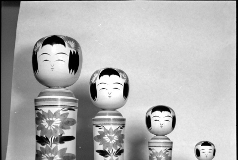Four wooden figures on display (ddr-densho-426-2211)