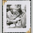 Men at food table (ddr-densho-434-288)