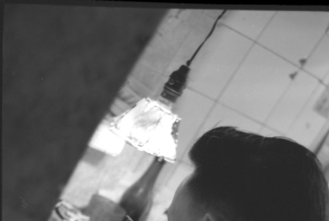 Man working with small hammer, possibly a jeweler (ddr-densho-426-2406)