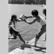 Pushing Julie Oji in the lake (ddr-densho-336-585)
